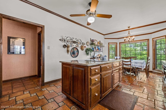 1920 Airpark Rd, Wynne, AR 72396 - kitchen featuring crown molding, baseboards, a chandelier, a ceiling fan, and light stone countertops