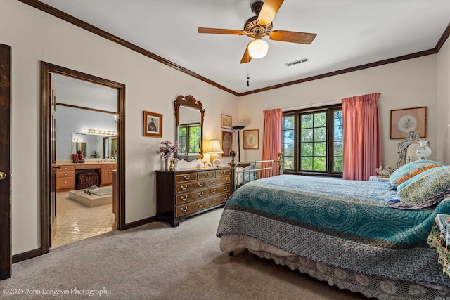 1920 Airpark Rd, Wynne, AR 72396 - carpeted bedroom with ornamental molding, baseboards, ceiling fan, and ensuite bath
