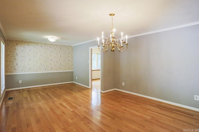 29 Flintwood Dr, Little Rock, AR 72227 - spare room featuring a chandelier, ornamental molding, light wood-style floors, baseboards, and wallpapered walls