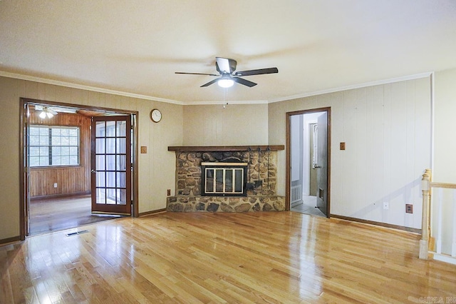 29 Flintwood Dr, Little Rock, AR 72227 - unfurnished living room with wood finished floors, a ceiling fan, crown molding, baseboards, and a stone fireplace