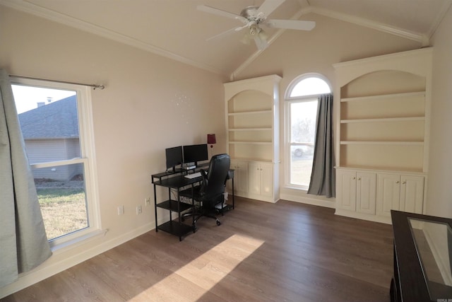 office space featuring wood finished floors, a ceiling fan, built in shelves, vaulted ceiling, and baseboards