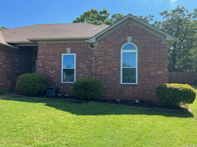 view of home's exterior featuring brick siding