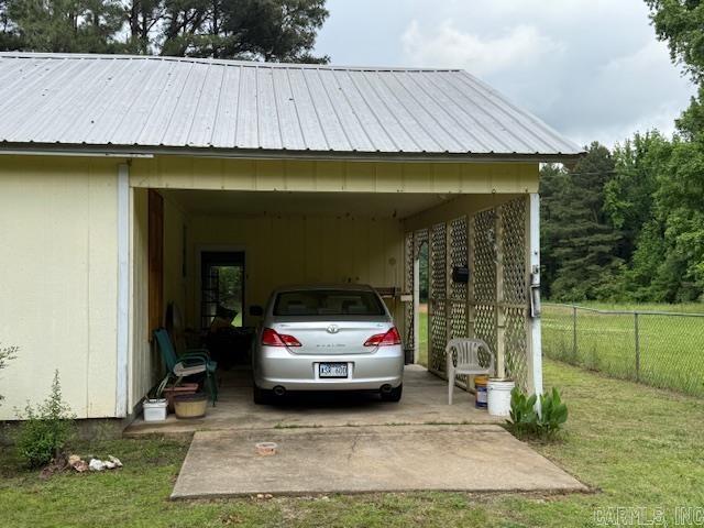 24/82 Whites Cut Rd, Carlisle, AR 72024 - view of parking featuring a carport and concrete driveway