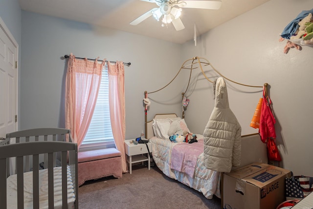 carpeted bedroom with multiple windows and ceiling fan