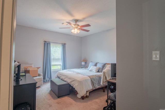 bedroom featuring light colored carpet and ceiling fan