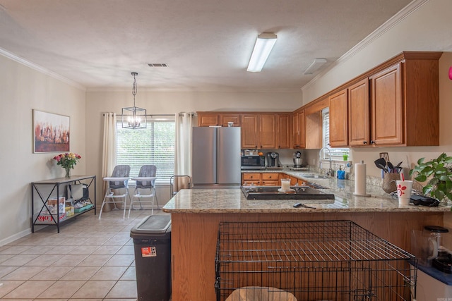 kitchen with stainless steel appliances, a sink, a peninsula, light stone counters, and light tile patterned floors
