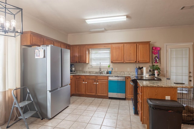 kitchen with appliances with stainless steel finishes, a sink, a peninsula, brown cabinetry, and crown molding