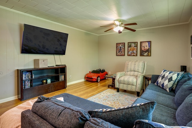 312 N E St, Harrisburg, AR 72432 - living room featuring ornamental molding, wood finished floors, a ceiling fan, and baseboards