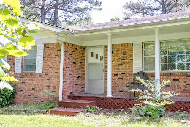 312 N E St, Harrisburg, AR 72432 - property entrance with brick siding and covered porch