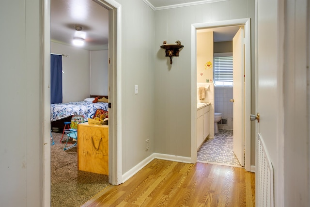 312 N E St, Harrisburg, AR 72432 - hall with light wood-type flooring and ornamental molding
