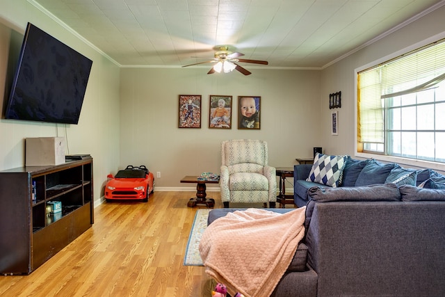 312 N E St, Harrisburg, AR 72432 - living room with ornamental molding, light wood-type flooring, a ceiling fan, and baseboards