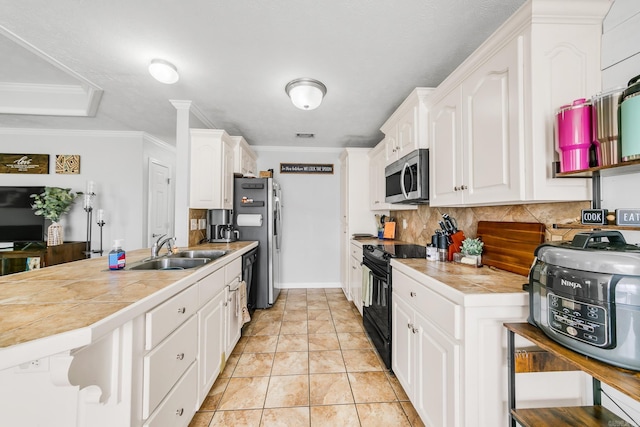 142 Peach St, Austin, AR 72007 - kitchen with appliances with stainless steel finishes, a sink, a peninsula, tasteful backsplash, and white cabinetry
