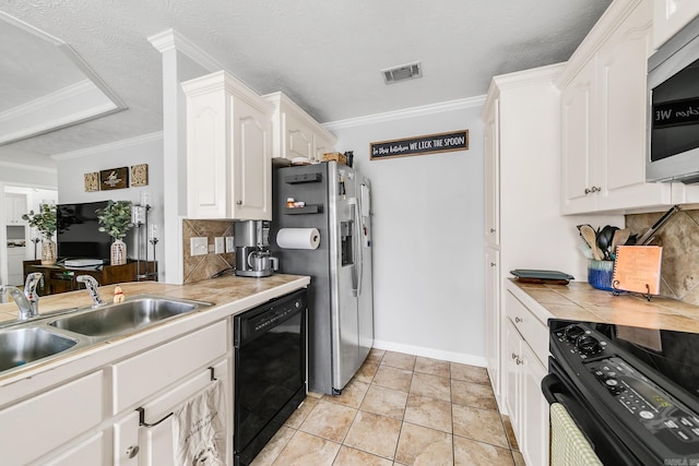 142 Peach St, Austin, AR 72007 - kitchen with black appliances, a sink, decorative backsplash, white cabinets, and ornamental molding