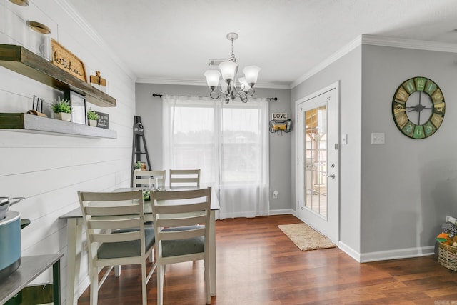 142 Peach St, Austin, AR 72007 - dining room with a chandelier, dark wood-style floors, healthy amount of natural light, and ornamental molding