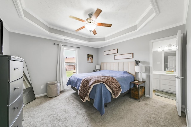 142 Peach St, Austin, AR 72007 - carpeted bedroom featuring a raised ceiling, crown molding, ensuite bath, and ceiling fan