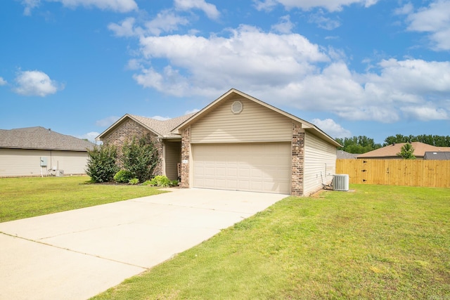 142 Peach St, Austin, AR 72007 - view of front facade with driveway, brick siding, an attached garage, and central AC