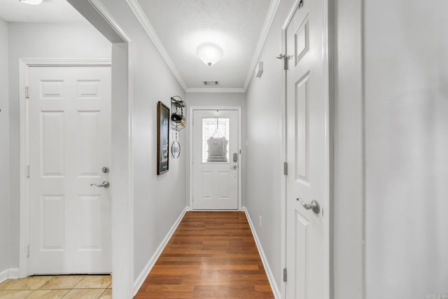 142 Peach St, Austin, AR 72007 - entryway with baseboards, crown molding, and light wood-type flooring