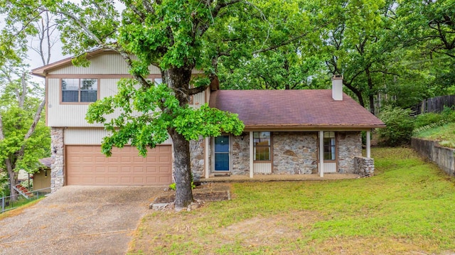 4 Desoto Forest Cv, Little Rock, AR 72211 - view of front of house featuring stone siding, driveway, a chimney, and an attached garage