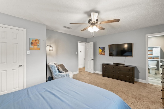 4 Desoto Forest Cv, Little Rock, AR 72211 - bedroom with carpet, a textured ceiling, baseboards, ensuite bath, and ceiling fan