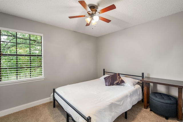 4 Desoto Forest Cv, Little Rock, AR 72211 - bedroom featuring light colored carpet, baseboards, a ceiling fan, and a textured ceiling
