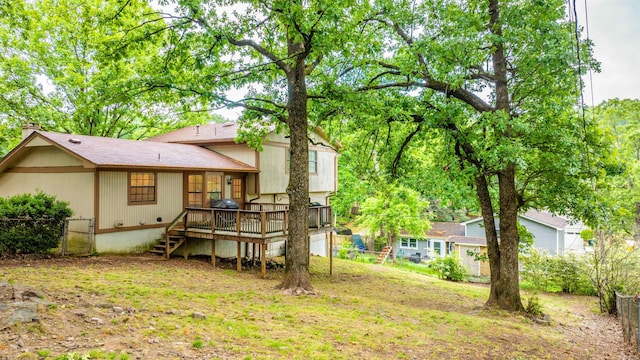 4 Desoto Forest Cv, Little Rock, AR 72211 - back of house featuring a wooden deck, fence, stairs, and a chimney