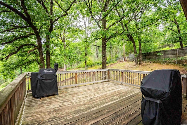 4 Desoto Forest Cv, Little Rock, AR 72211 - wooden deck featuring grilling area and a fenced backyard