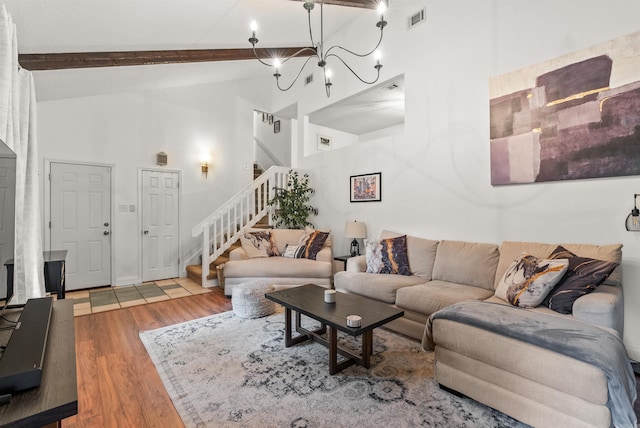 4 Desoto Forest Cv, Little Rock, AR 72211 - living area with wood finished floors, stairway, beam ceiling, a chandelier, and high vaulted ceiling