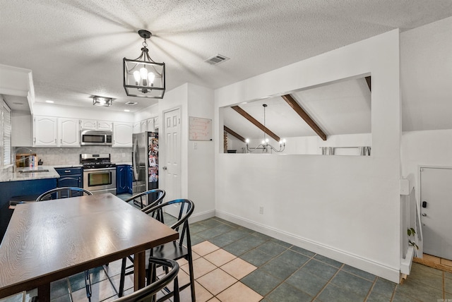 4 Desoto Forest Cv, Little Rock, AR 72211 - dining area with a chandelier, baseboards, tile patterned floors, and a textured ceiling