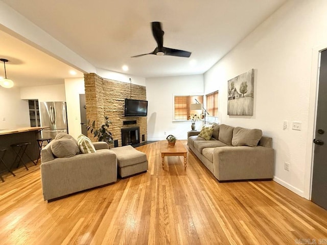 601 Clarence St, Mountain View, AR 72560 - living room featuring ceiling fan, light wood-style floors, a fireplace, and recessed lighting