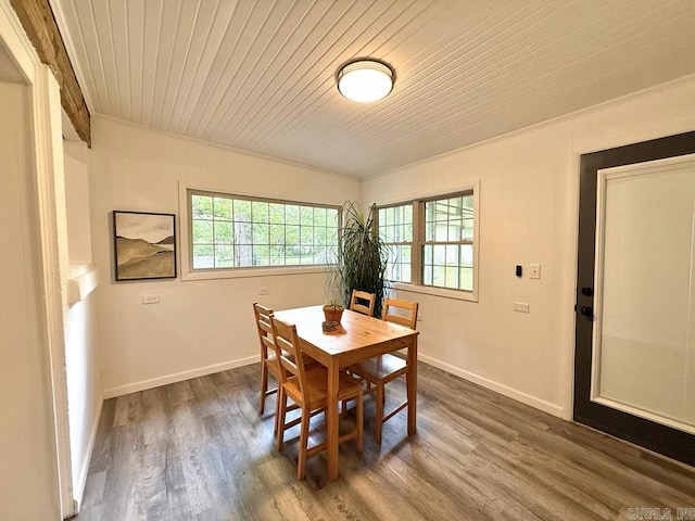 601 Clarence St, Mountain View, AR 72560 - dining area with healthy amount of natural light, wood ceiling, dark wood-style floors, and baseboards