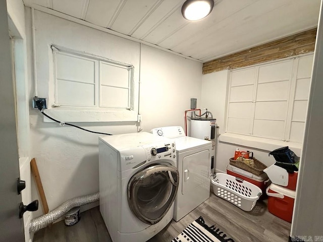 601 Clarence St, Mountain View, AR 72560 - clothes washing area with wood finished floors and washing machine and clothes dryer