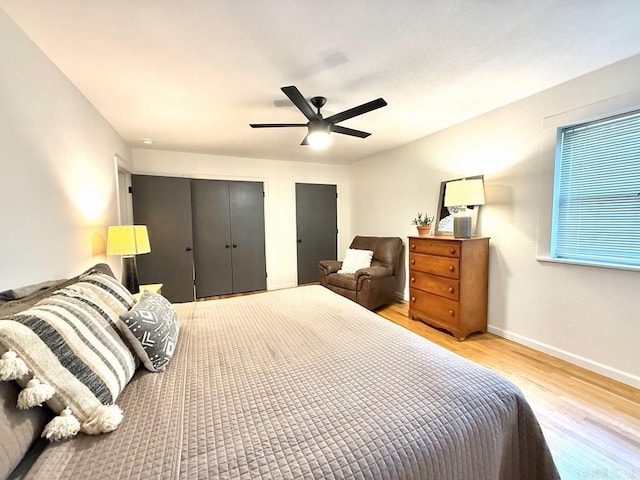 601 Clarence St, Mountain View, AR 72560 - bedroom with light wood-style flooring, baseboards, and a ceiling fan