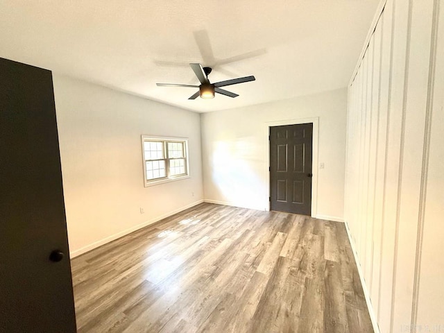601 Clarence St, Mountain View, AR 72560 - unfurnished room with wood finished floors, ceiling fan, and baseboards