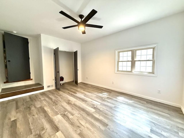 601 Clarence St, Mountain View, AR 72560 - unfurnished bedroom featuring wood finished floors, baseboards, and ceiling fan