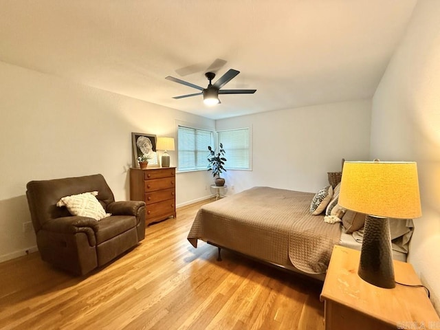 601 Clarence St, Mountain View, AR 72560 - bedroom with light wood-style flooring, ceiling fan, and baseboards