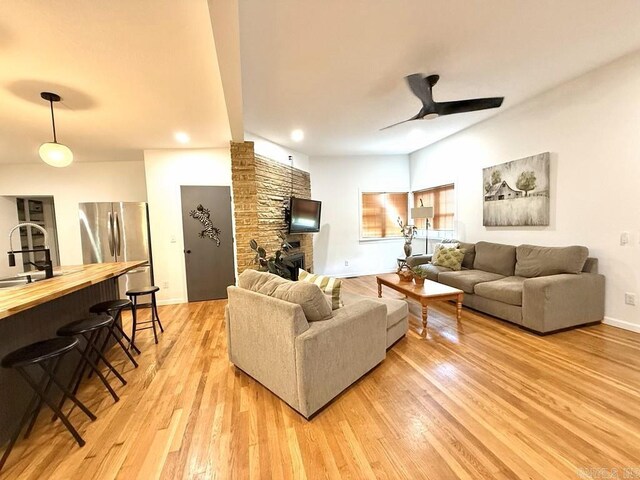 601 Clarence St, Mountain View, AR 72560 - living area featuring light wood-style floors, a ceiling fan, recessed lighting, and baseboards