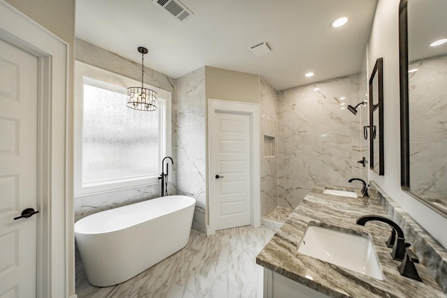 912 Lakeshore Dr, Heber Springs, AR 72543 - bathroom with healthy amount of natural light, marble tiled floors, double vanity, a freestanding bath, and recessed lighting