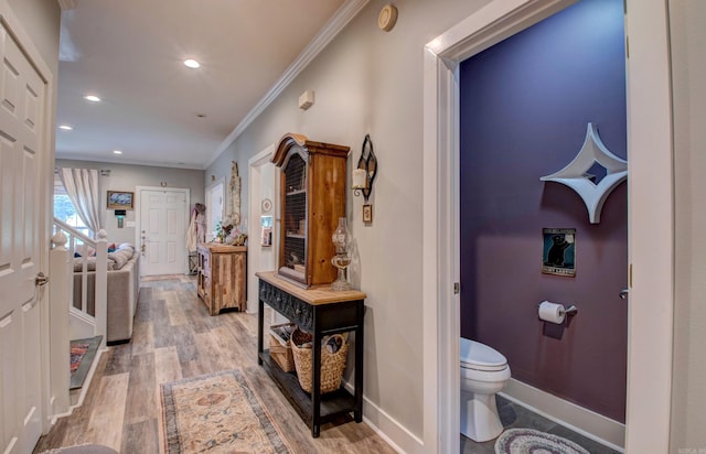 12420 Brodie Creek Trl, Little Rock, AR 72211 - hallway featuring crown molding, light wood-style floors, recessed lighting, and baseboards