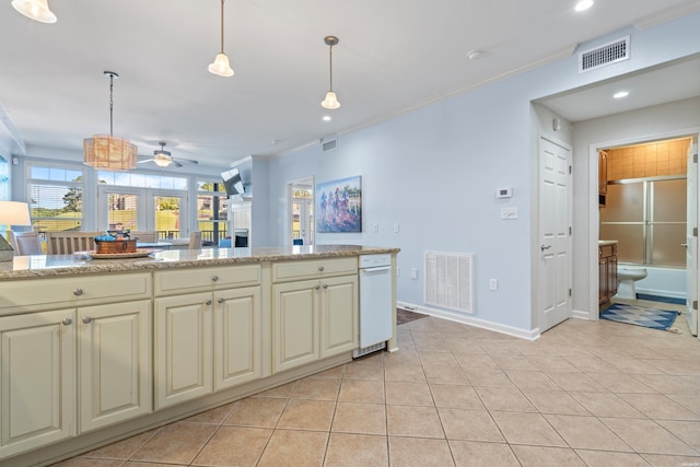 kitchen with cream cabinets, crown molding, a ceiling fan, hanging light fixtures, and recessed lighting