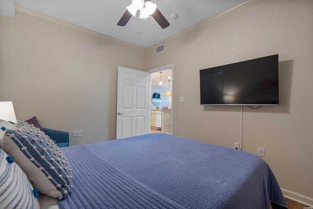 bedroom featuring crown molding, baseboards, wood finished floors, and ceiling fan