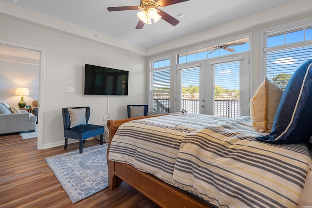 bedroom featuring access to outside, wood finished floors, baseboards, and a ceiling fan