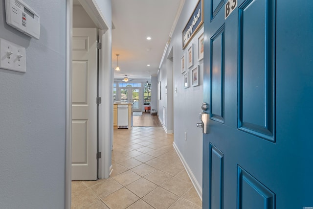 foyer entrance with light tile patterned floors, a ceiling fan, baseboards, and recessed lighting
