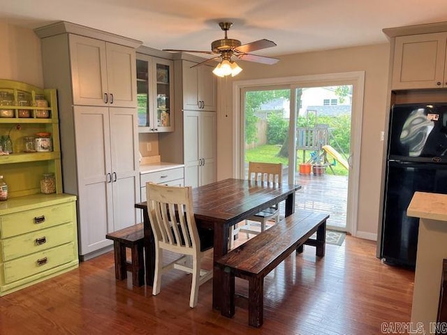 dining room with a ceiling fan and wood finished floors