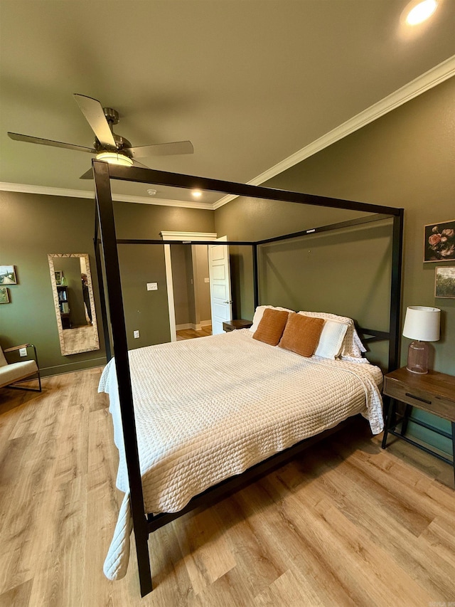 bedroom featuring light wood finished floors, crown molding, recessed lighting, a ceiling fan, and baseboards