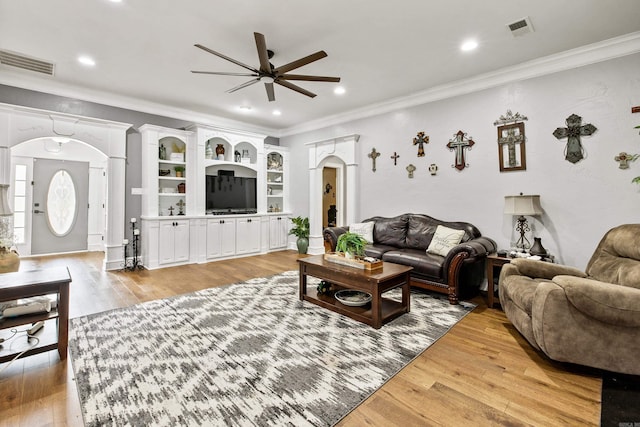 2724 Crooked Stick Dr, Benton, AR 72015 - living room featuring a ceiling fan, ornamental molding, arched walkways, light wood-type flooring, and recessed lighting