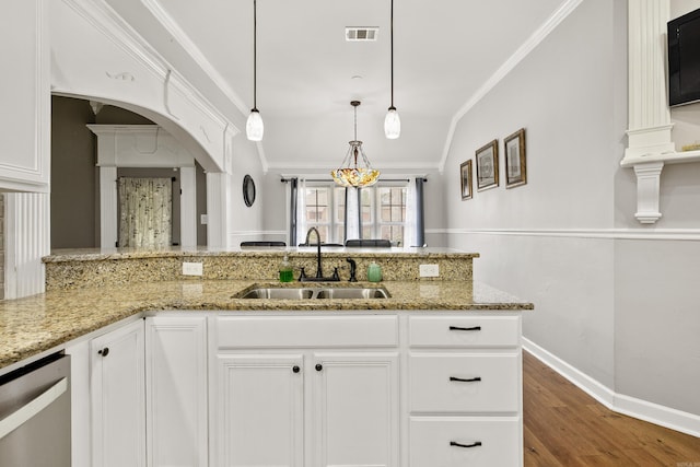 2724 Crooked Stick Dr, Benton, AR 72015 - kitchen featuring a sink, crown molding, dishwasher, arched walkways, and light stone counters