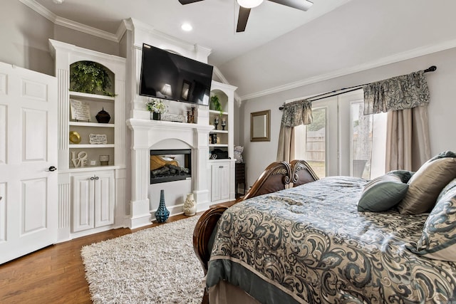 2724 Crooked Stick Dr, Benton, AR 72015 - bedroom featuring wood finished floors, ornamental molding, a multi sided fireplace, ceiling fan, and lofted ceiling