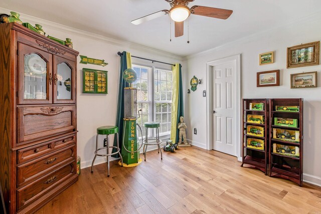2724 Crooked Stick Dr, Benton, AR 72015 - sitting room with light wood-style floors, baseboards, crown molding, and a ceiling fan