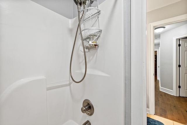 2724 Crooked Stick Dr, Benton, AR 72015 - bathroom view of wood finished floors, shower / tub combination, and baseboards