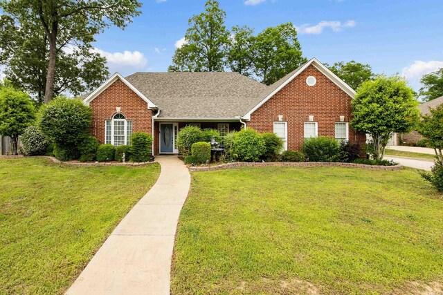 2724 Crooked Stick Dr, Benton, AR 72015 - traditional-style home with brick siding, a front lawn, and a shingled roof